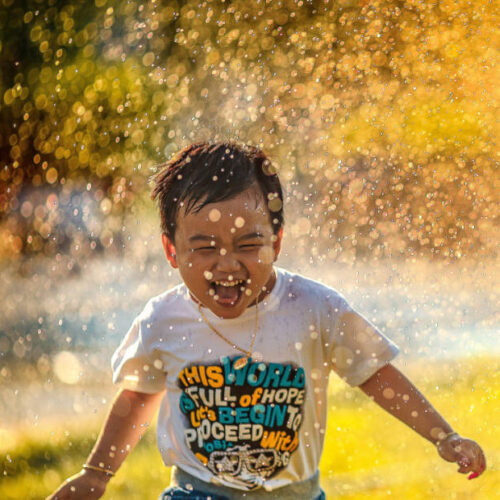 Boy Running Through Water