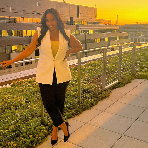 businesswoman-white-jacket-sunset-rooftop